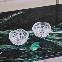 لاليك منحوتة على شكل سمكة صغيرة خضراء