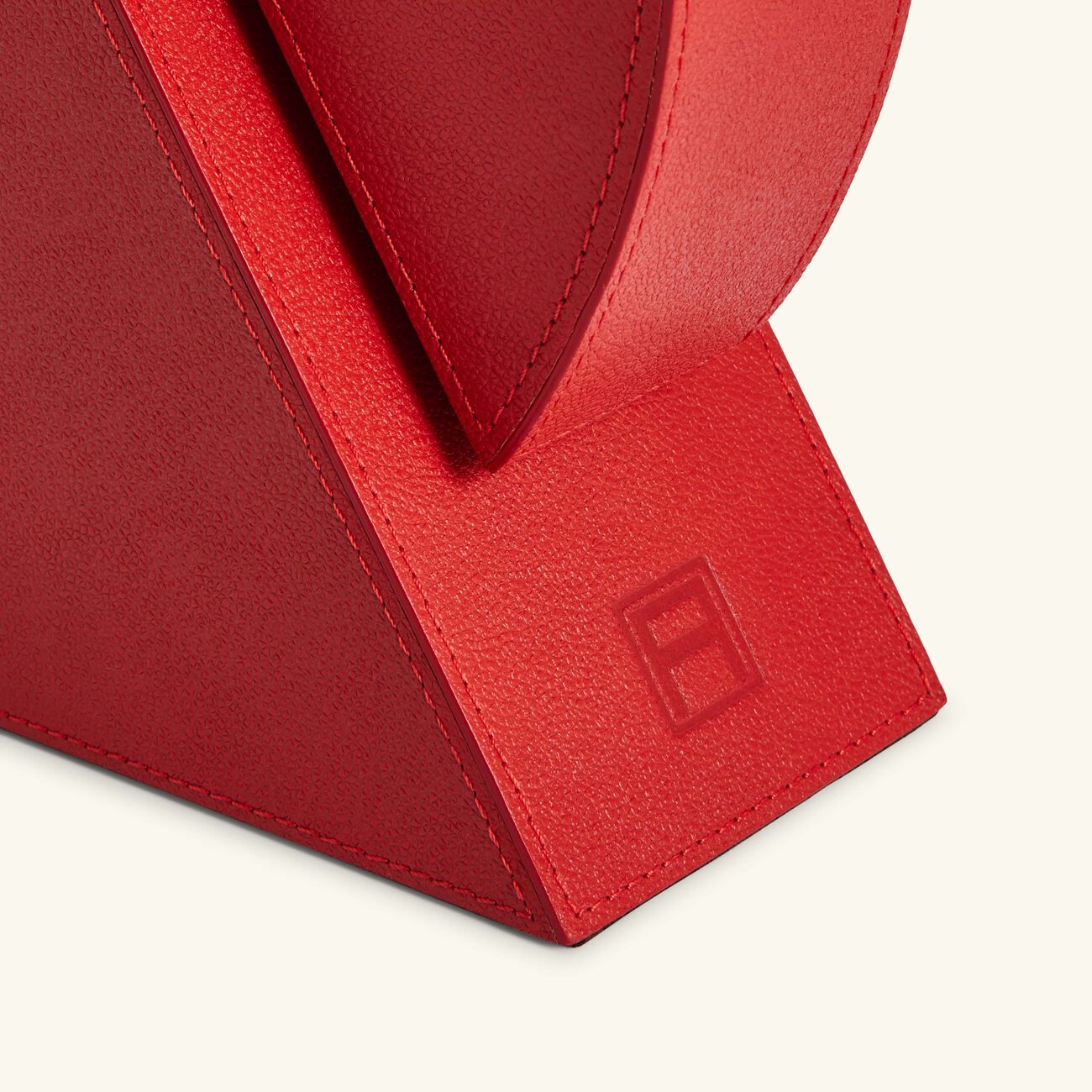 آسولين مسند كتب أحمر تكعيبي التصميم   لإسناد الكتب من اليمين